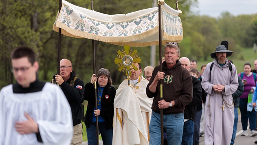 Pilgrims process from St. Theodore's Catholic Church through the town of  Laporte, Minn., May 20, 2024, during the National Eucharistic Pilgrimage. (OSV News photo/Courtney Meyer)