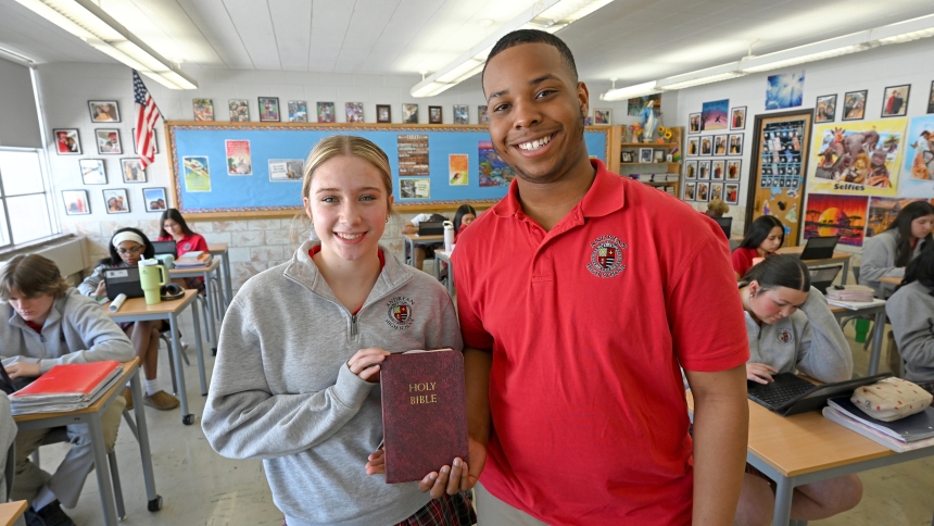 Andrean High School sophomores Madeline Linkliter (front, left) and Armani Green (front, right) stand at the head of their theology class at the Merrillville campus on Feb. 18. The 59ers are among the students who participate in not only their academic, athletic and extra-curricular activities, but also engage in the many volunteer charitable opportunities afforded to them through the campus ministry and theology departments. (Anthony D. Alonzo photo)