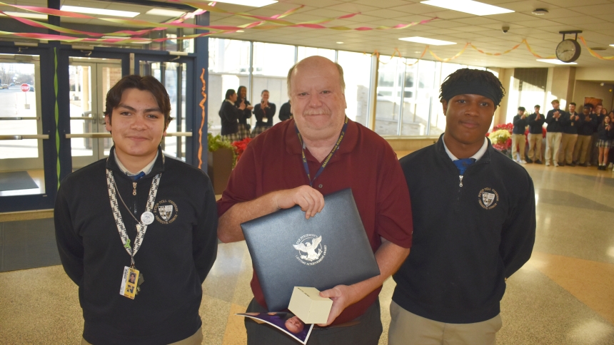 Brian Pillar (center), a teacher at Bishop Noll Institute in Hammond, was nominated for the Presidential Lifetime Achievement Award by Business Honor Society vice president Julian Villagomez (left) and president Jonathan Johnson. (Provided photo)