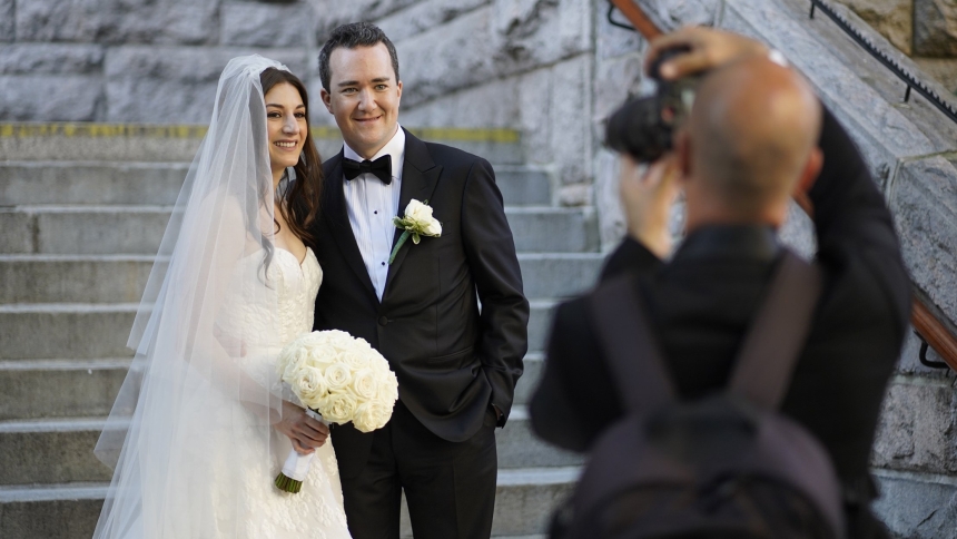 A bride and groom pose for a photo outside St. Paul the Apostle Church in New York City following their wedding in 2022. (OSV News photo/Gregory A. Shemitz)