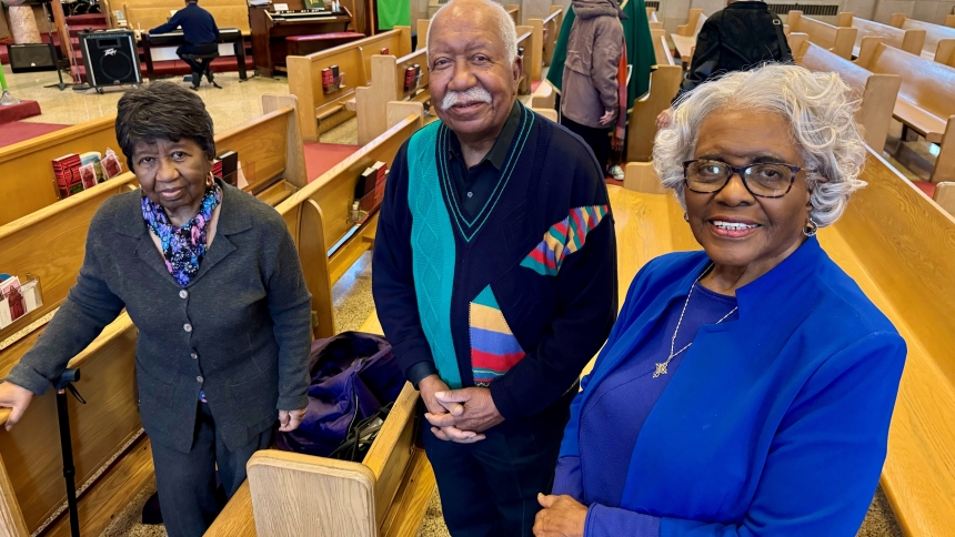 After Sunday Mass, longtime Ss. Monica and Luke parishioners Minnie Durosseaux (front, left), 95, James Henley (front, center), 90, and Anne Thompson (front, right), 95, stand in their pews in Gary on Feb. 23. A combined church since 1982, Ss. Monica and Luke brought together a parish with a long history of being home to many of  Gary's black Catholics who not only serve among their fellow parishioners in word and sacrament, but also offer charitable initiatives such as a food pantry and soup kitchen for th