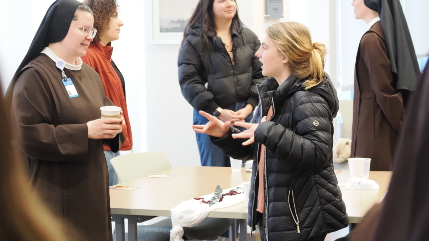 Sisters of St. Francis of Perpetual Adoration members take time to speak with women during Franciscan Health-Michigan City’s Beloved Brunch on March 3. (Deacon Bob Wellinski photo)  