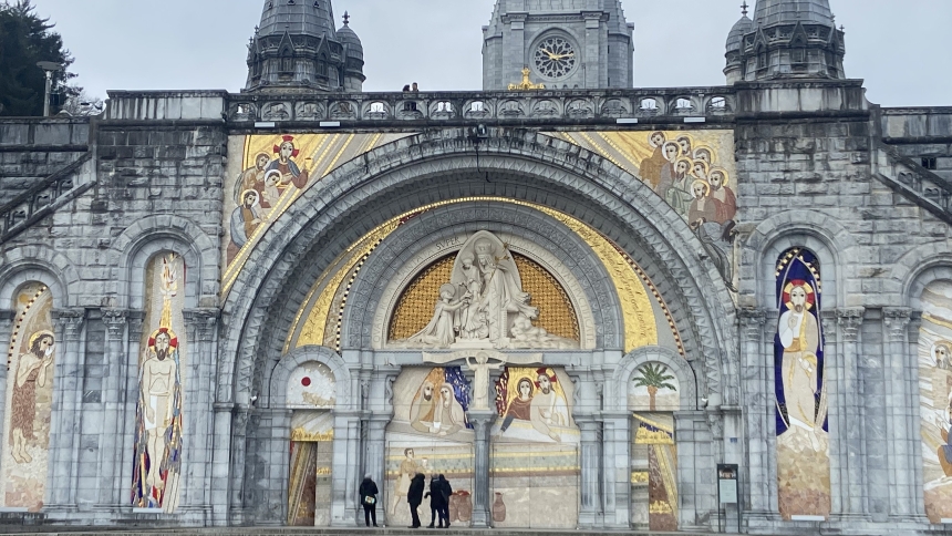 The uncovered facade of the Basilica of Our Lady of the Rosary is pictured at the Sanctuary of Our Lady of Lourdes in southwestern France in April 2023. The facade showcases the artwork of Father Marko Rupnik, a priest and former Jesuit, who is currently under investigation after accusations of spiritual, psychological and sexual abuse by multiple adult women. Bishop Jean-Marc Micas of Tarbes and Lourdes said March 31, 2025, that the sanctuary will cover the mosaics on the door of the basilica. (OSV News ph