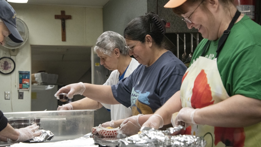 Manna for Hammond kitchen volunteers including Marge Kovacik (right) pack lunches at the ministry, popularly known St. Joseph Soup Kitchen, on St. Patrick's Day, March 17. Founded 40 years ago, the outreach for the poor at is the longest-running five-day soup kitchen in the diocese. (Anthony D. Alonzo photo)