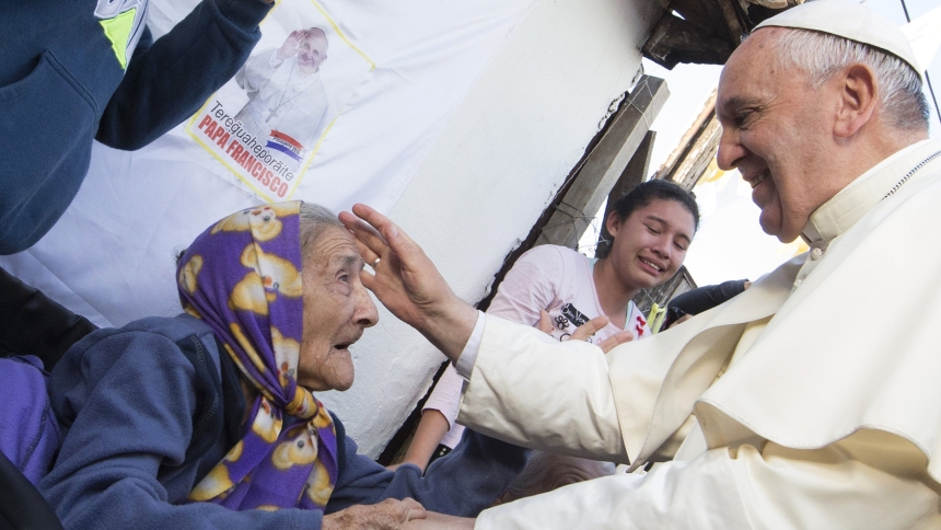 Pope Francis greets an elderly woman as he meets with people of the Banado Norte neighborhood in the Chapel of St. John the Baptist in Asuncion, Paraguay, July 12, 2015. Pope Francis, formerly Argentine Cardinal Jorge Mario Bergoglio, died April 21, 2025, at age 88. (CNS photo/Paul Haring)