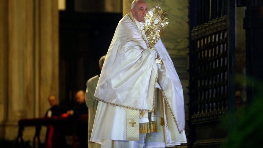 Pope Francis holds the monstrance as he gives his extraordinary blessing "urbi et orbi" (to the city and the world) from the atrium of St. Peter's Basilica at the Vatican March 27, 2020. Pope Francis, formerly Argentine Cardinal Jorge Mario Bergoglio, died April 21, 2025, at age 88. (OSV News photo/Yara Nardi, pool via Reuters)