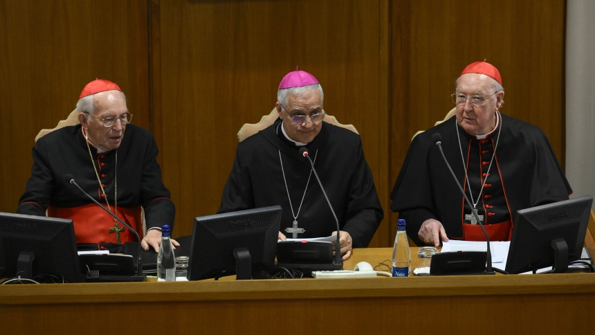 Benedictine Abbot Donato Ogliari, abbot of St. Paul Outside the Walls in Rome, center, offered a spiritual meditation April 29, 2025, in the Vatican synod hall to cardinals attending the general congregation before the conclave begins. The abbot is seated between Cardinal Giovanni Battista Re, dean of the College of Cardinals, and Cardinal Kevin J. Farrell, chamberlain of the Holy Roman Church. (CNS photo/Vatican Media)