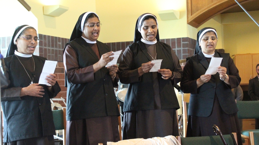 Four Sisters from the Congregation of the Mother of Carmel, (from left) Sister Rose Paul, Sister Alphy Anns, Sister Ruby Therese and Sister Ann Jyothis, formed a choir to sing a song of thanksgiving, "Victorious, Victorious, Our Lady of Carmel" after Holy Communion at the golden jubilee Mass on March 30 at St. Michael the Archangel in Schererville. The Mass marked the 50th anniversary of the religious order's arrival in the United States. (Marlene A. Zloza photo)