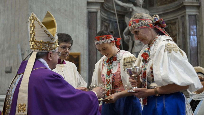 Women wearing traditional dress present the offertory gifts to Archbishop Bernard Bober of Košice, president of the Slovak bishops' conference, during a Mass in St. Peter's Basilica at the Vatican with about 4,300 Holy Year pilgrims from Slovakia April 4, 2025. (CNS photo/Vatican Media)