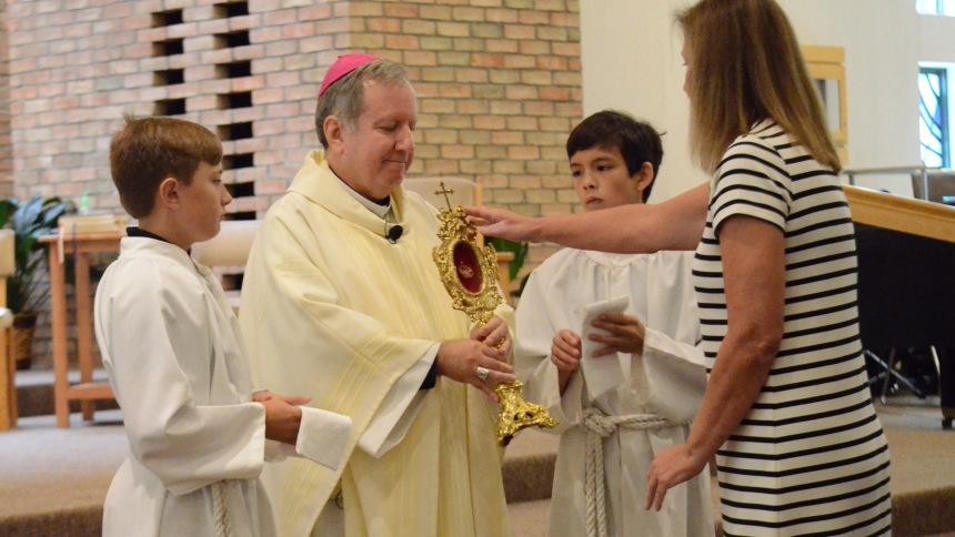 Bishop Robert J. McClory holds a first-class relic of Blessed Carlo Acutis following a Mass on Sept. 11 at St. Patrick in Chesterton. After the service, students and parishoners came forward to venerate the relic. The parish will also host a special Mass at 10 a.m. on Oct. 12, the Feast Day of Blessed Carlo Acutis, providing another opporunity for faithful to view the relic. (Erin Ciszczon photo)