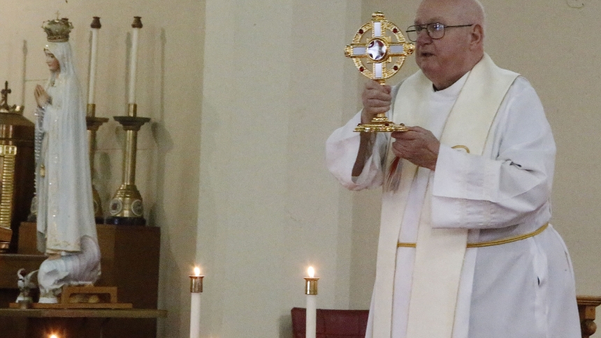 Father Ciesla with relic 