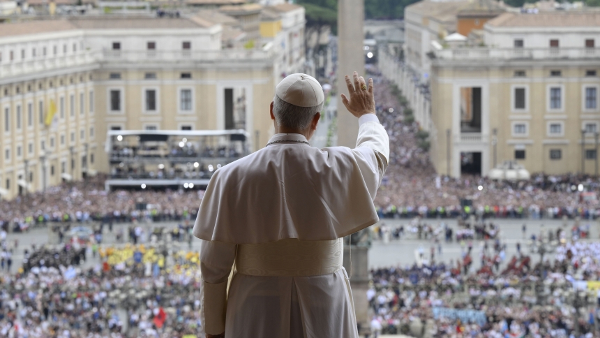 Pope Leo XIV waves to the crowd from the central balcony of St. Peter's Basilica at the Vatican as he leads, for the first time, the midday recitation of the "Regina Coeli" prayer May 11, 2025. (CNS photo/Vatican Media)