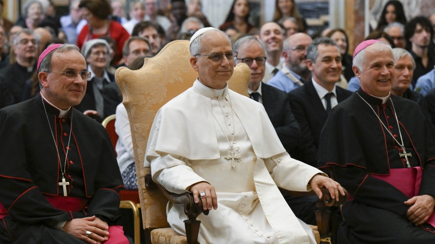 Pope Leo XIV poses for a photograph with members of grassroots groups and Catholic associations that work for peace and justice during an audience at the Vatican May 30, 2025. To the left of the pope is Bishop Domenico Pompili of Verona, Italy. (CNS photo/Vatican Media)