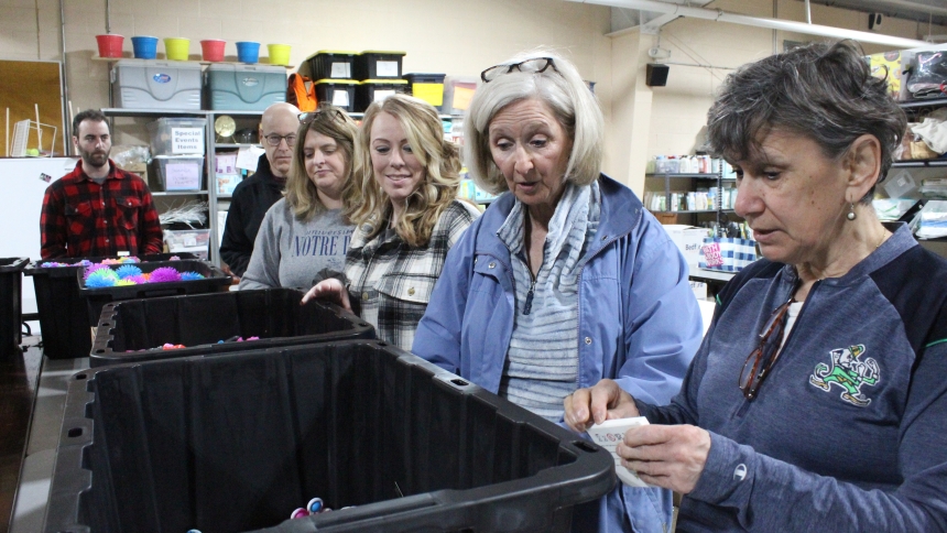 Fran Callahan (right), of DeMotte, and Kathy DeGuilio Fox, of Highland, lead the assembly line of Notre Dame Club of Northwest Indiana members and friends filling Ben's Blue Bags with items for autistic and other special needs youth and adults who need calming in a crisis. The service project for the Crown Point nonprofit was part of the 12th annual ND Global Day of Service. (Marlene A. Zloza photo)
