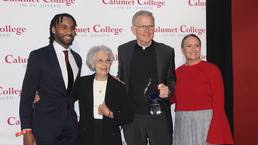 Representing the Precious Blood Ministry of Reconciliation, Sister Donna Liette, C.PP.S. (second from left) and Father David Kelly, C.PP.S., are presented with the Calumet College of St. Joseph Corporate Leadership Award by student Josh Morris (left) and college president Dr. Amy McCormack. The honor was announced at the 60th Annual Board of Trustees' Scholarship Gala on April 11 at the Hard Rock Casino in Gary. (Marlene A. Zloza photo)