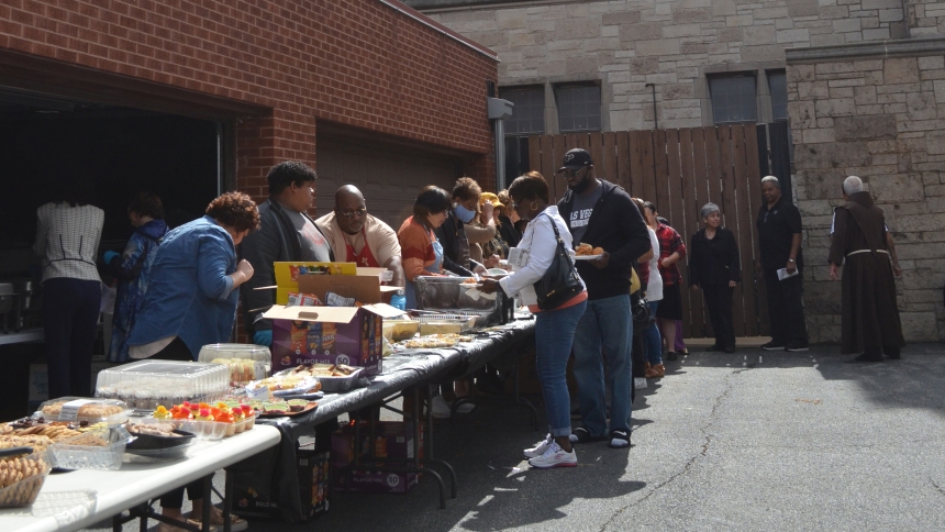 Following Mass celebrating the Solemnity of the Guardian Angels, members of the diocese marked the feast day on Oct. 2, 2022 with a picnic set up between the rectory and school on the grounds of the Cathedral of the Holy Angels in Gary. (NWIC file photo/Erin Ciszczon)