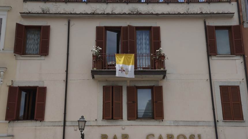 A Vatican flag is seen on a balcony on the main square outside the papal palace in Castel Gandolfo, south of Rome, May 29, 2025, the day Pope Leo XIV visited. (CNS photo/Pablo Esparza)
