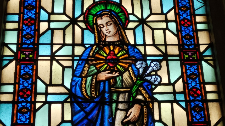 Sunday morning light illuminates the Immaculate Heart of Mary, a stained-glass window at St. Bridget, Hobart. (Angela Hughes photo)