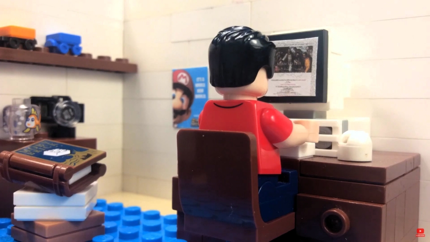 Blessed Carlo Acutis sits in front of a computer in a scene from a stop-motion animation Lego-Carlo Acutis film made by three brothers in Limerick County, Ireland, and released in mind-May 2025 on their YouTube channel, Fiontar Floinn. On the wall to left is a blue poster of the last Super Mario Bros video game to be released in the lifetime of Blessed Carlo (1996-2006). (OSV News photo/courtesy Flynn family) Editors: best quality available.
