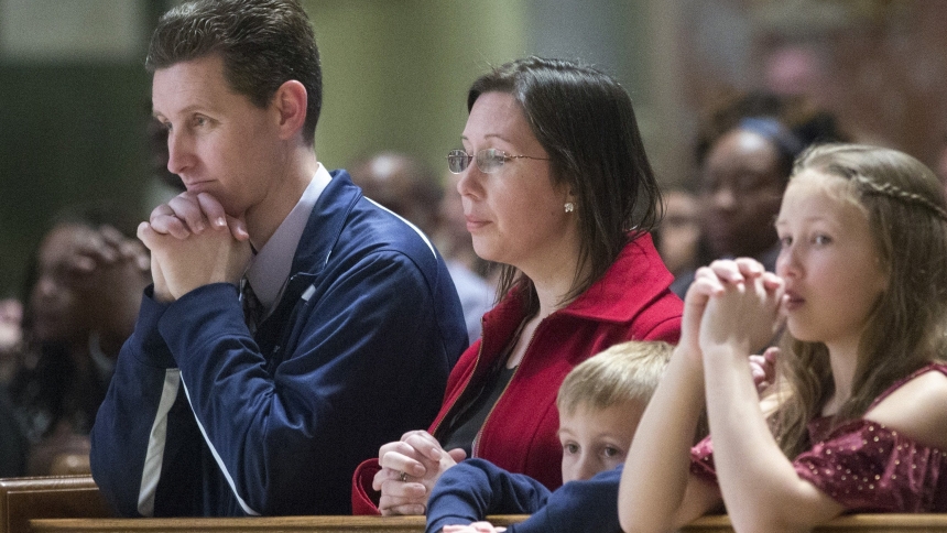 A file photo shows a family praying during Mass at the Cathedral of St. Matthew the Apostle in Washington. The Pew Research Center released a June 16, 2025, analysis of U.S. Catholic life. (OSV News photo/Jaclyn Lippelmann, Catholic Standard)