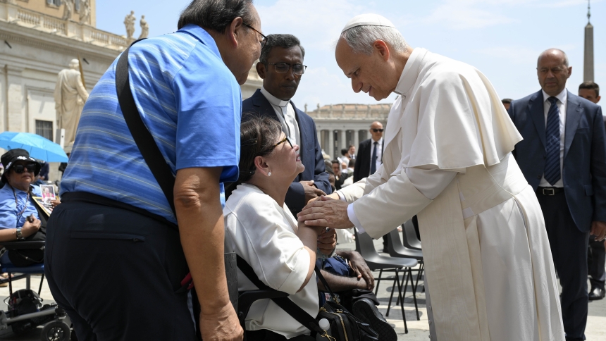Pope Leo XIV blesses a woman in St. Peter's Square after his general audience at the Vatican June 18, 2025. (CNS photo/Vatican Media)
