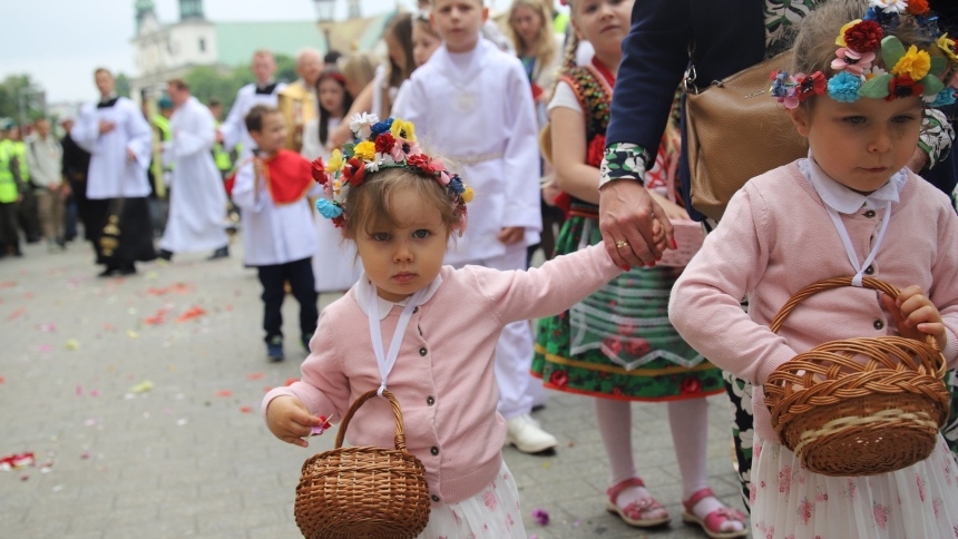 Girls in traditional Polish attire throw flower petals as they take part in a Corpus Christi procession June 8, 2023, in Krakow. On June 19, 2025, cities, towns and villages held solemn Eucharistic processions, publicly professing belief in Christ's real presence in the Eucharist on the feast of Corpus Christ. (OSV News photo/courtesy Archdioceses of Krakow)