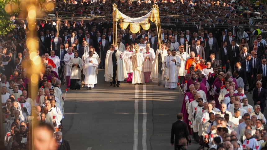 Under a canopy, Pope Leo XIV carries the Eucharist in a monstrance during a Corpus Christi procession from Rome's Basilica of St. John Lateran to the Basilica of St. Mary Major June 22, 2025. (CNS photo/Lola Gomez)