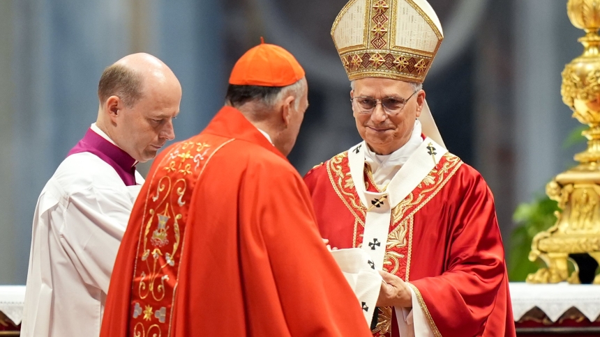 Pope Leo XIV presents the pallium to Cardinal Robert W. McElroy of Washington during Mass in St. Peter’s Basilica at the Vatican June 29, 2025, the feast of Sts. Peter and Paul. The pallium, which symbolizes an archbishop’s authority and unity with the pope, is given to metropolitan archbishops. (CNS photo/Lola Gomez)