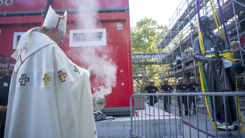 Paris Archbishop Laurent Ulrich uses a censer June 23, 2025, near a statue of St. Paul, the first of the 16 now-renovated statues that adorn the roof of Notre Dame Cathedral, as it is about to be lifted by crane, marking the last phase of reconstruction of the cathedral's roof, damaged by the April 2019 fire. (OSV News photo/courtesy David Bordes, Rebâtir Notre-Dame de Paris)
