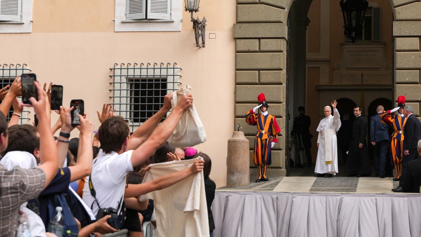 Pope Leo XIV greets visitors as he departs following his first Angelus prayer in Castel Gandolfo, Italy, July 13, 2025. (CNS photo/Lola Gomez)
