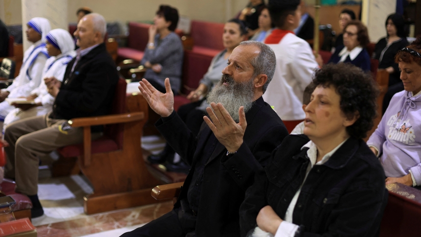 Palestinian Christians attend Mass at Holy Family Church in Gaza City after the death of Pope Francis was announced by the Vatican, April 21, 2025. Father Gabriel Romanelli, pastor of Holy Family Church, admitted his flock is exhausted by war and a severe lack of food. The priest spoke to Vatican Radio amid tragedy after tragedy unfolding in the enclave, with at least 32 people killed by Israeli strikes only on July 13, including six children at a water collection point. (OSV News photo/Dawoud Abu Alkas, Re