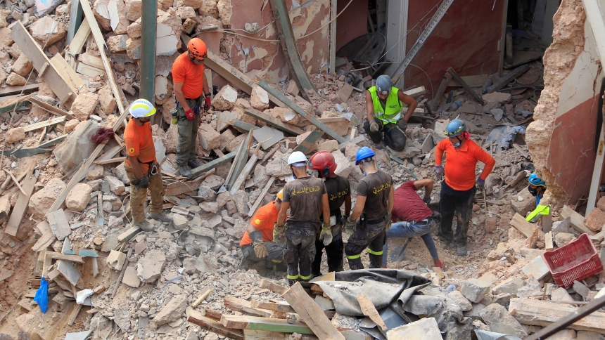 Members of a rescue team search through rubble of destroyed buildings in Beirut's port area Sept. 4, 2020, one month after a massive explosion. The blast killed more than 200 people, injured some 7,000 others and displaced more than 300,000. (OSV News photo/Aziz Taher, Reuters)