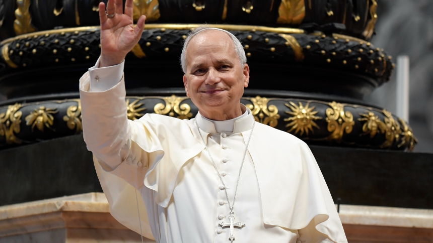 Pope Leo XIV greets pilgrims gathered inside St. Peter’s Basilica at the Vatican Aug. 13, 2025, after his weekly general audience. The pope visited them at the conclusion of the audience to offer his blessing, as the Paul VI hall had reached full capacity. (CNS photo/Vatican Media)