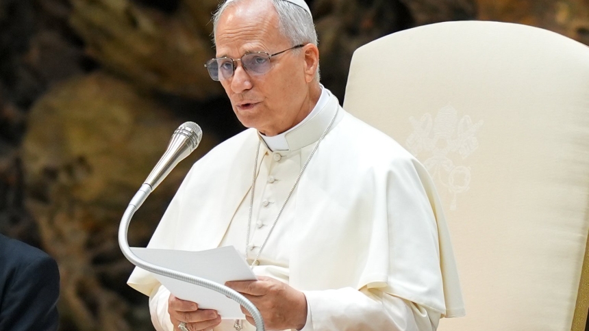 Pope Leo XIV talks to visitors during his weekly general audience in the Paul VI Audience Hall at the Vatican Aug. 20, 2025. (CNS photo/Lola Gomez)