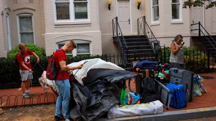 Members of the Georgetown Ministry Center assist Shelley Byars, 47, a homeless woman, in Washington Aug. 15, 2025. President Donald Trump announced Aug. 11 he was placing the District of Columbia police "under direct federal control," activating the National Guard and getting rid of homeless encampments in an effort to combat crime in the district. (OSV News photo/Jose Luis Gonzalez, Reuters)