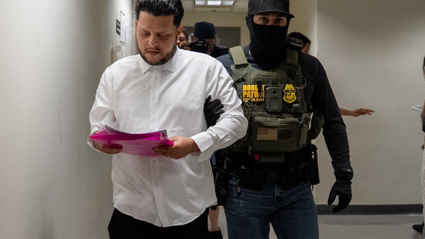 A migrant is detained by federal immigration officers at the U.S. immigration court in the Manhattan borough of New York City July 25, 2025. (OSV News photo/David 'Dee' Delgado, Reuters)