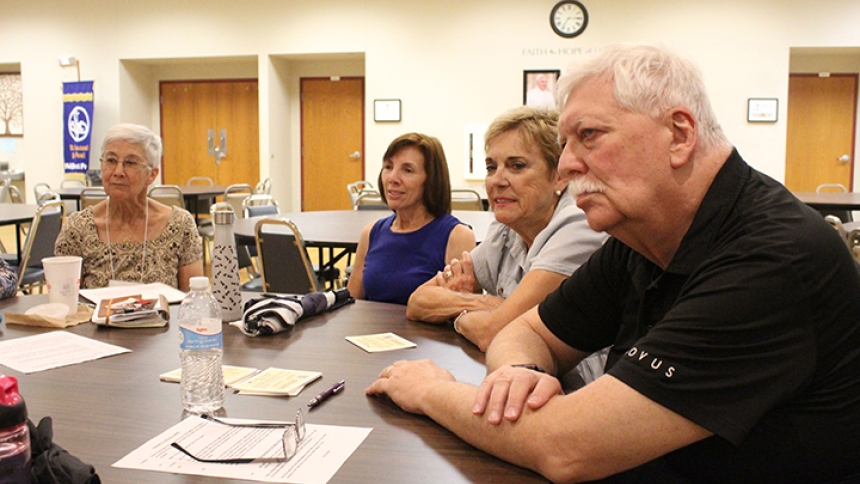 Diocese of Gary Cursillo alumni, including spiritual guide Father Thomas Mischler (right), listen to a comment at their Aug. 12 Ultreya about a fellow member’s spiritual achievement during the past month. The group also spent time planning for upcoming weekend retreats, which many of them will participate in as presenters and team members. (Marlene A. Zloza photo)