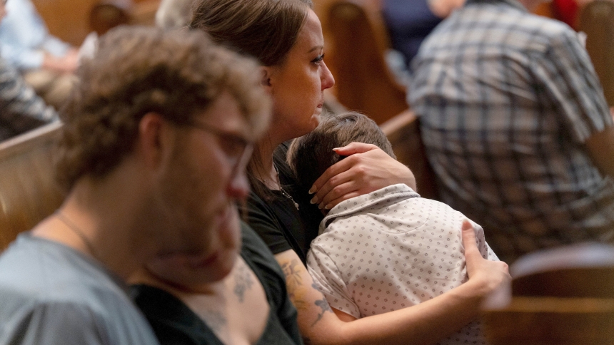 Mary Perez embraces her son, Felix, a first-grade student at Annunciation Catholic School in Minneapolis, during an interfaith prayer service at the Basilica of St. Mary in Minneapolis Aug. 28, 2025. The previous day, a shooter opened fire through the windows of the church next to the school during an all-school Mass, killing two children and wounding 21 other victims. (OSV News photo/Tim Evans, Reuters)