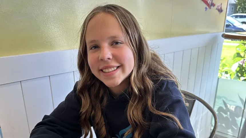 This is a screenshot from the GoFundMe page of 12-year-old Sophia Forchas, left in critical condition with head injuries when bullets tore through Annunciation Church in Minneapolis Aug. 27, 2025. Blessing her forehead and both hands with holy water from Lourdes, France, as she lay unconscious in a hospital bed in Minneapolis, Auxiliary Bishop Michael J. Izen of St. Paul and Minneapolis, prayed for her. (OSV News photo/Sophia Forchas, GoFundMe)