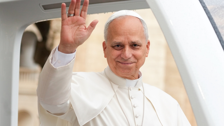 Pope Leo XIV greets visitors and pilgrims from the popemobile under the rain in St. Peter’s Square at the Vatican before his weekly general audience Sept. 10, 2025. (CNS photo/Lola Gomez)