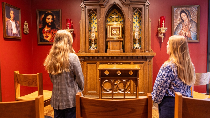 Two women pray at the new St. Pier Giorgio Frassati Chapel located next to the office of Immaculate Conception Parish in Washington Aug. 22, 2025. The new chapel is named for the new saint who was canonized by Pope Leo XIV on Sept. 7, 2025. St. Pier Giorgio, an Italian young adult who died in 1925, was known for his devotion to the Eucharist and service to those in need. (OSV News photo/Mihoko Owada, Catholic Standard)