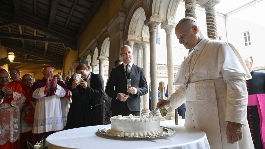 Pope Leo XIV slices a cake for his 70th birthday Sept. 14, 2025, as cardinals, Vatican officials and ecumenical leaders look on after a prayer service at Rome's Basilica of St. Paul Outside the Walls. (CNS photo/Vatican Media)