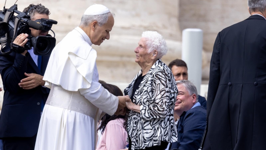 Pope Leo XIV greets a woman at his weekly general audience in St. Peter's Square at the Vatican Oct. 1, 2025. (CNS photo/Pablo Esparza)