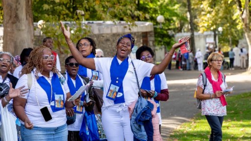 Pilgrim prays in Lourdes, France, as part of the Oct. 2-4, 2025, "Rosary Pilgrimage," organized by the Dominican order since 1908. The Marian shrine of Lourdes welcomed a record number of participants this year -- 17,000 pilgrims were present, 2,000 more than in 2024. (OSV News photo/courtesy Lourdes shrine)