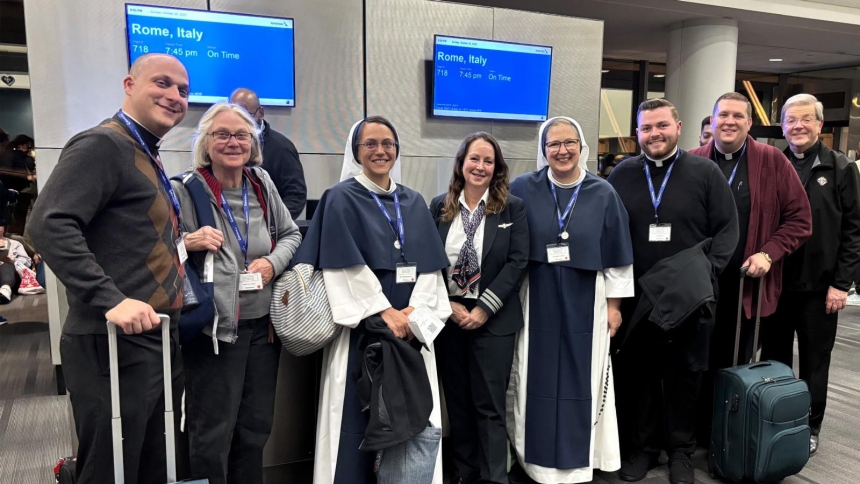 Some of the 100-plus Catholic pilgrims from the Diocese of Wilmington, Del., are headed to Italy from Philadelphia International Airport Oct. 26, 2025 for a pilgrimage led by Bishop William E. Koenig. Pictured from left to right are Father John Solomon and his mother and sister, Mary Solomon and Sister of Life Gianna Maria Solomon; Catholic American Airlines pilot Carol Stone; Sister of Life Amata Filia Dierschke; and Fathers James Gebhart, Joseph W. McQuaide IV and Joseph Piekarski. (OSV News photo/Bob Kre