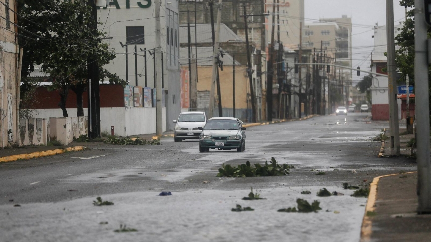 A car drives near debris on a road in Kingston, Jamaica, Oct. 27, 2025, as Hurricane Melissa approached. The slow-moving hurricane, a Category 5 storm with winds of ranging from 175-185 mph, had already killed at least seven - three in Haiti, one in the Dominican Republic and three in Jamaica - ahead of making landfall Oct. 28 in southwestern Jamaica at about 1 p.m. ET. (OSV News Octavio Jones, Reuters)