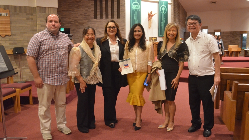 Those behind the planning of the Filipino Mass pose for a picture. (Erin Ciszczon photo)Iszczon
