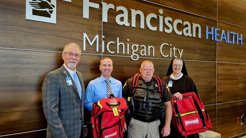 Franciscan Health Michigan City President and CEO Dean Mazzoni, LaPorte County Sheriff’s Office Administrative Capt. Derek Allen, LaPorte County Sheriff’s Office Captain Dallas Smythe and Vice President of Mission Integration for Franciscan Health’s Northern Indiana Division Sister M. Petra Nielsen display emergency equipment backpacks donated by the hospital to the Sheriff’s Office.