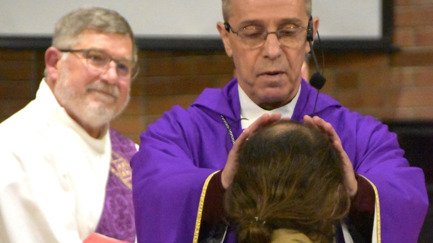 After celebrating a Mass at the Plainfield Correctional Facility in Plainfield, Ind., on March 26, 2023, Indianapolis Archbishop Charles C. Thompson offers a blessing to a man who was soon to be released from the facility. Deacon Martin "Neil" May smiles at left. (OSV News photo/Natalie Hoefer, The Criterion)