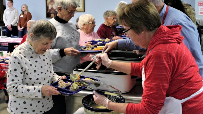 Volunteers serve food during the 20th annual Community Thanksgiving Dinner Nov. 23, 2019, at St. Mary Parish in Menasha, Wis. (OSV News photo/Brad Birkholz)